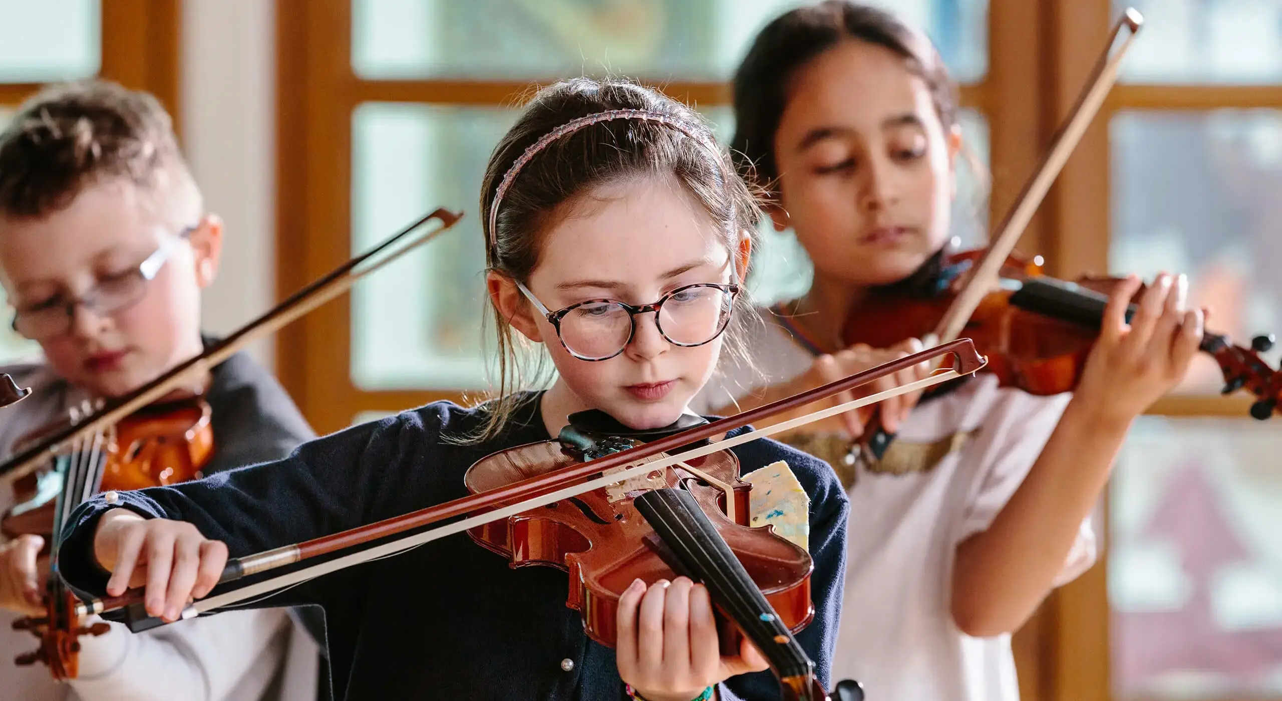 Girl playing violin at St Chris