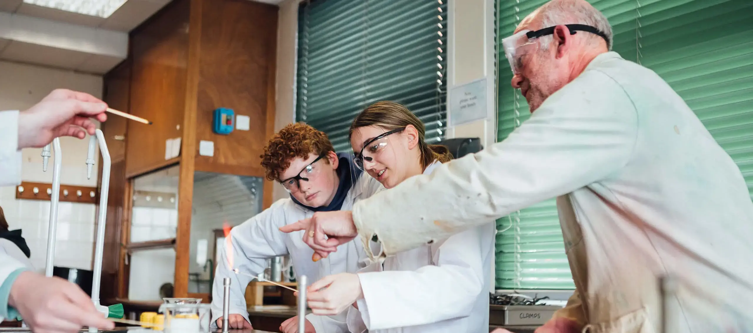 Teacher with students in Science class