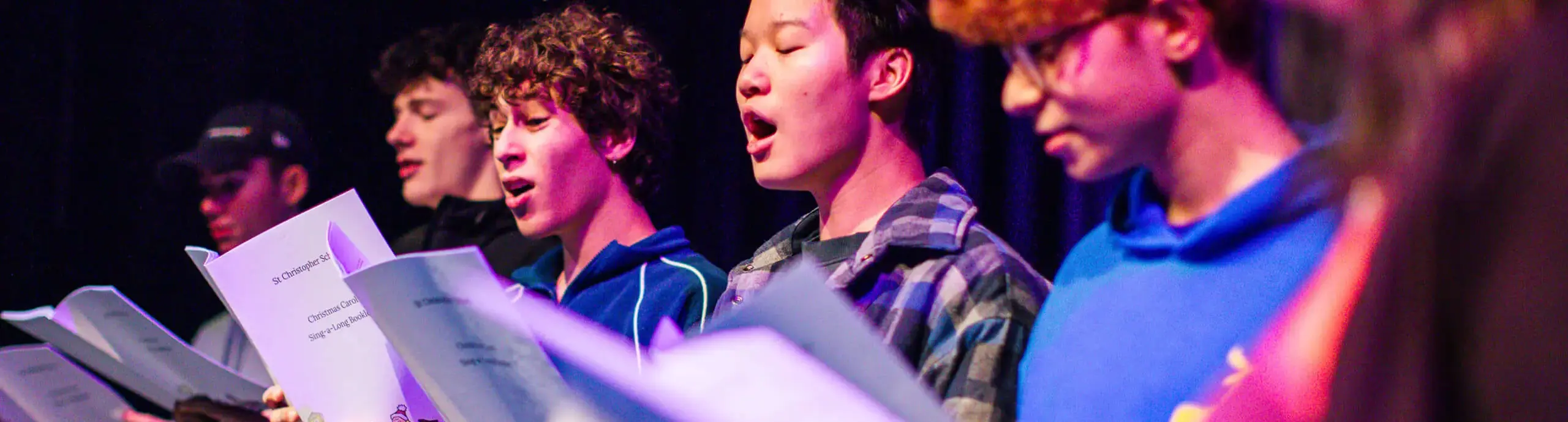 Senior School pupils singing on stage