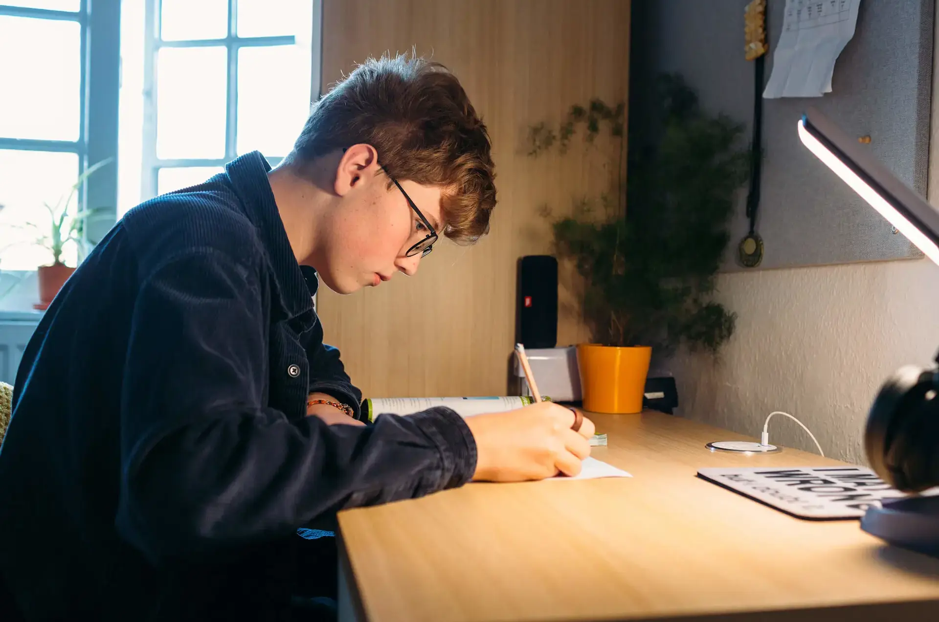 Student working in his room at St Chris